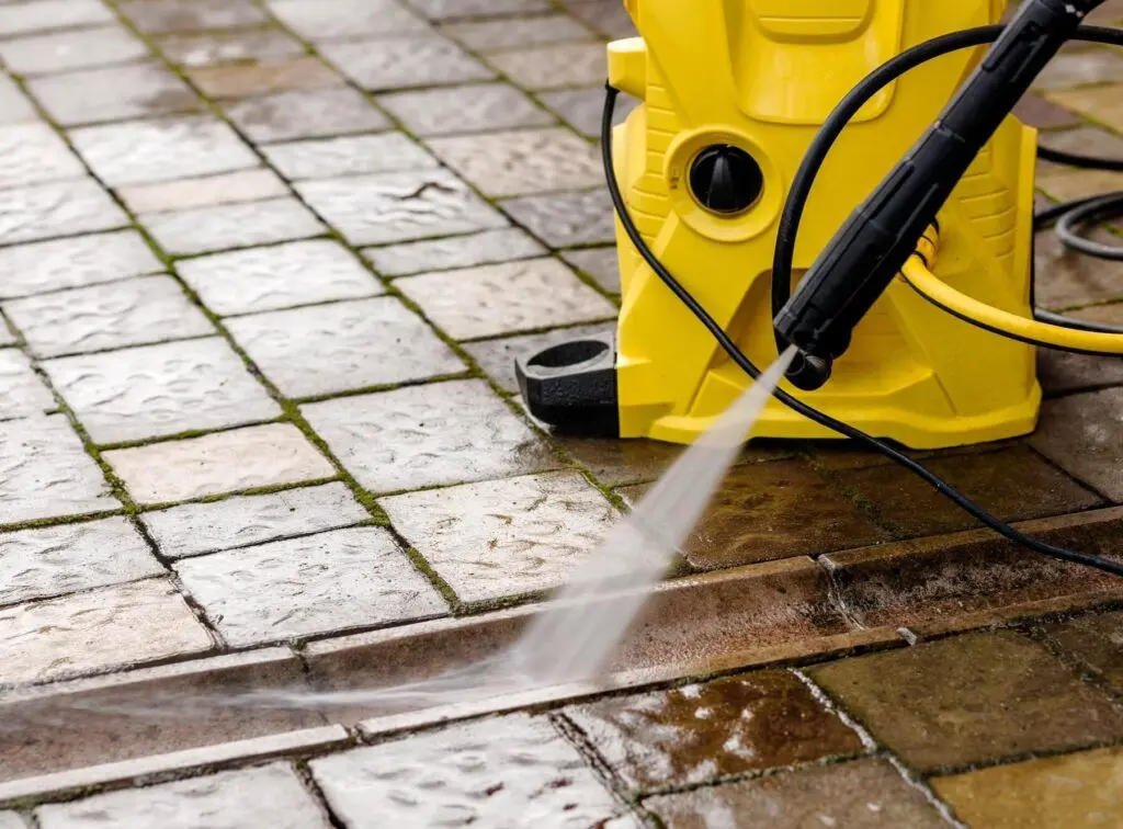 Pressure cleaning revealing clean concrete on a Brisbane driveway